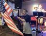 Loyal Lauren Glick fan Adam proudly waved the American flag while Lauren sang our national anthem to close the show at Bourbon St.